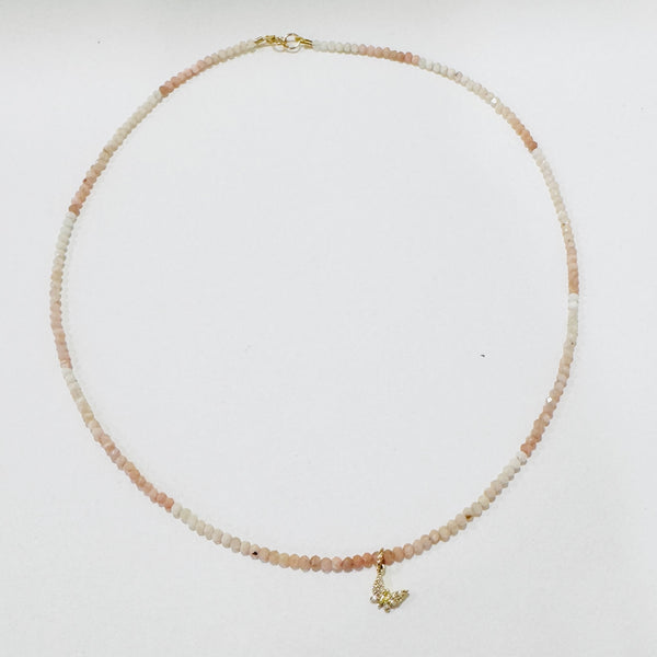 delicate gemstone necklace with diamond butterfly charm