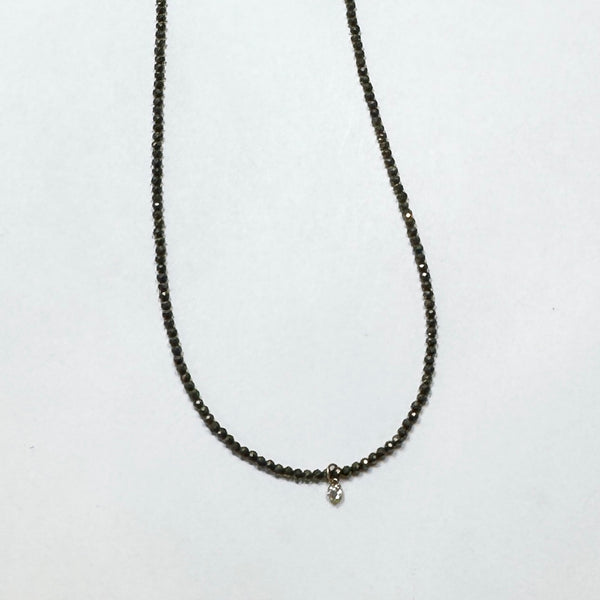 delicate necklace with prong set diamond