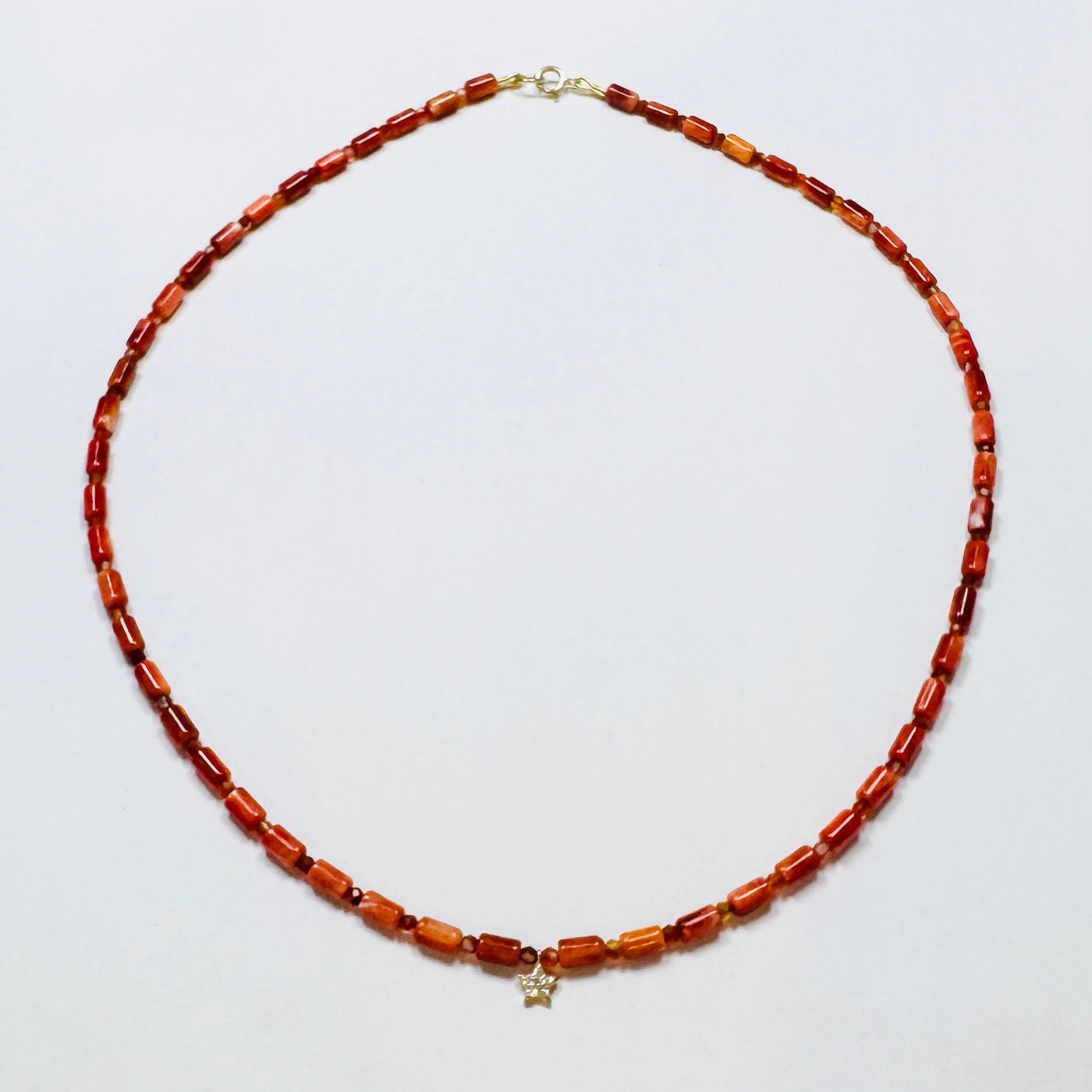 coral tube necklace with diamond star bead