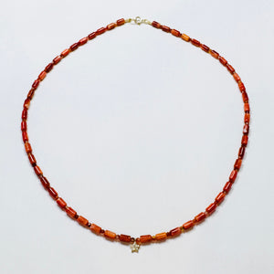 coral tube necklace with diamond star bead