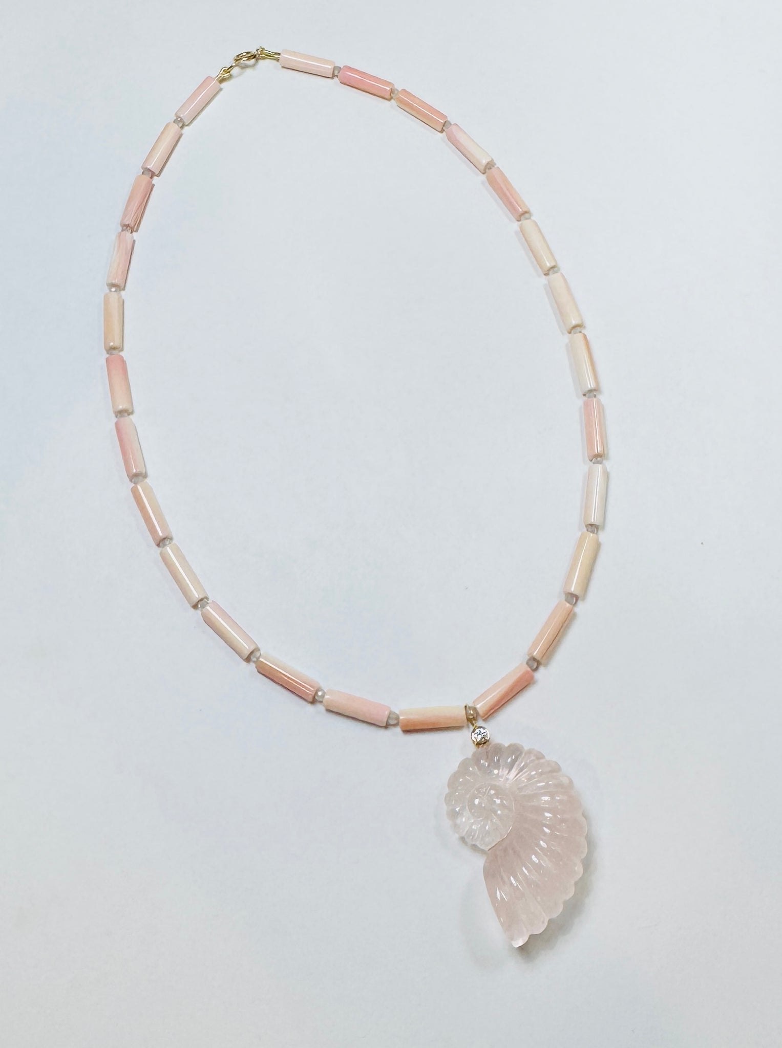 tube conch necklace with rose quartz nautilus pendant