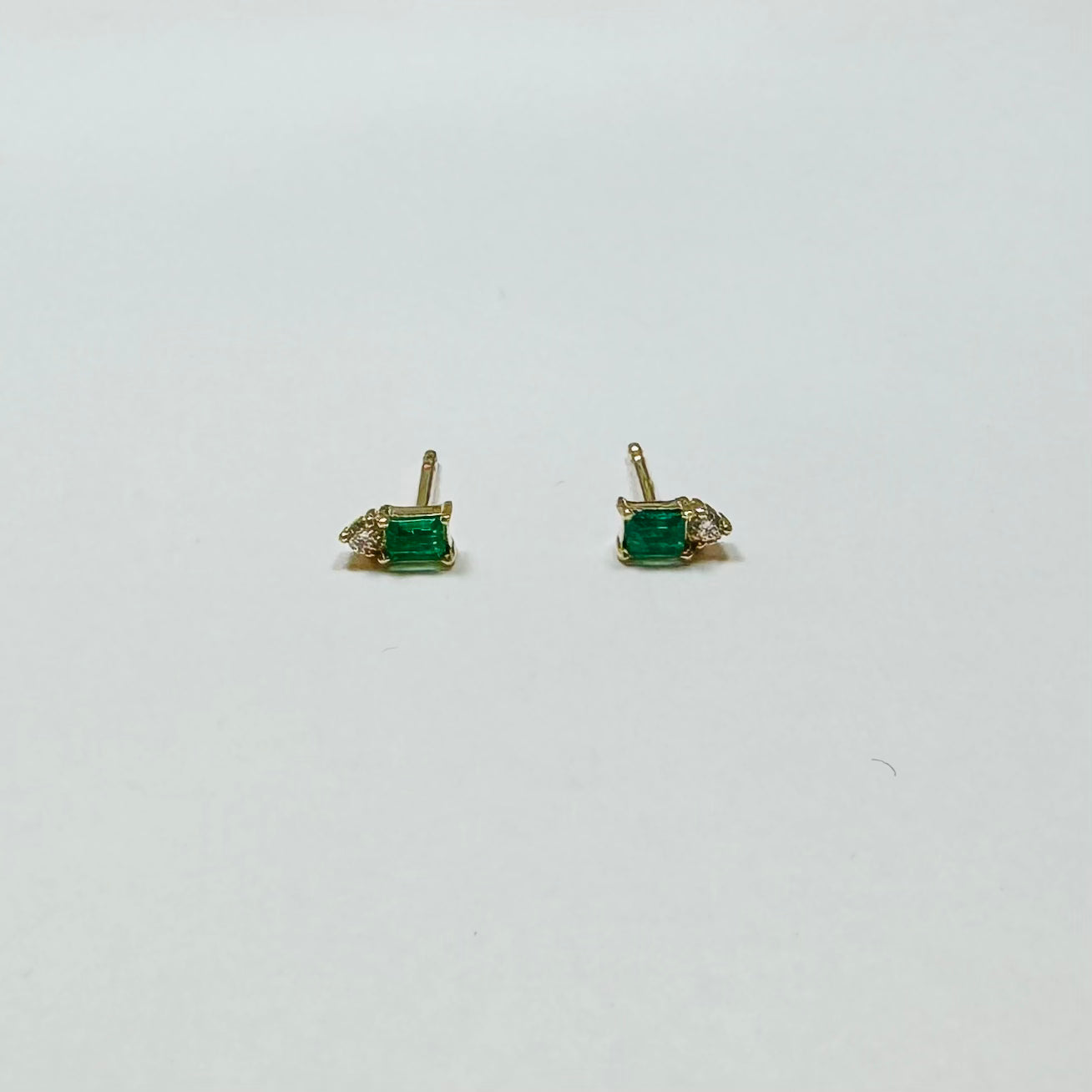 emerald baguette and diamond cluster studs