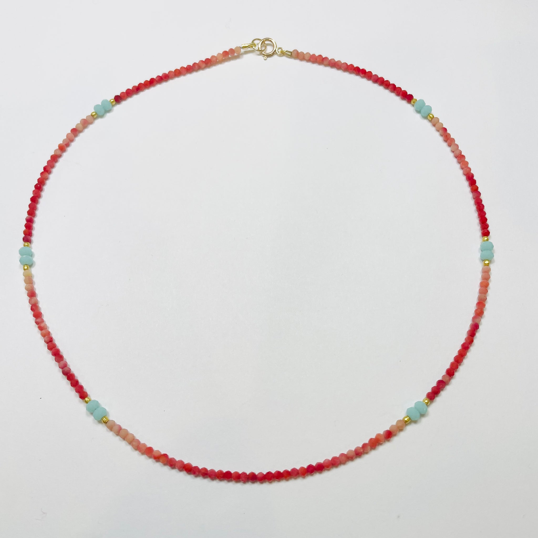 delicate rhodochrosite necklace with turquoise chalcedony and gold nuggets
