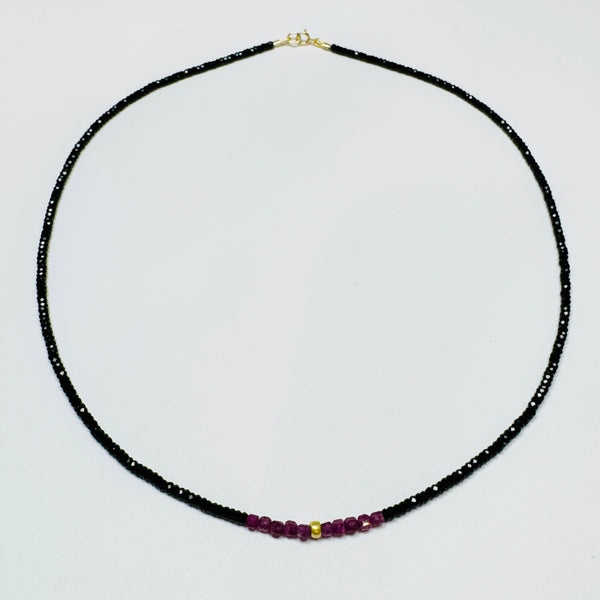 delicate onyx necklace with ruby cubes and center gold nugget