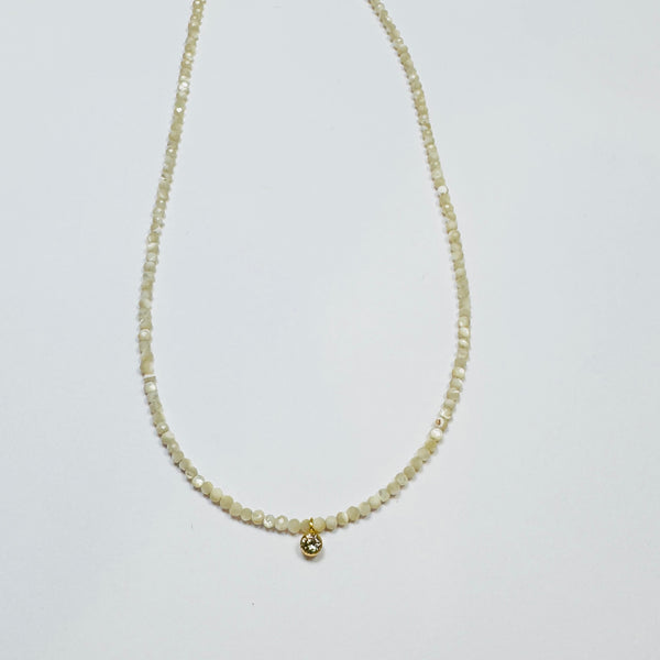 delicate necklace with bezel set diamond