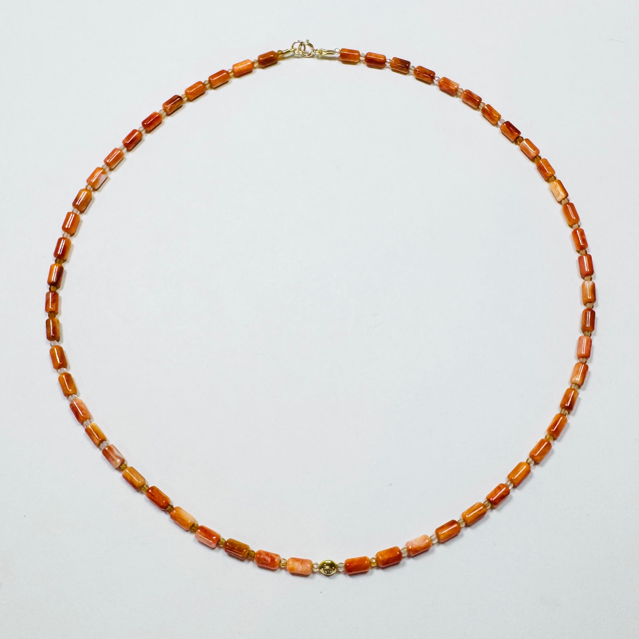 coral tube necklace with diamond star bead