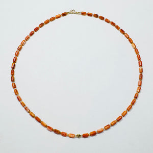 coral tube necklace with diamond star bead