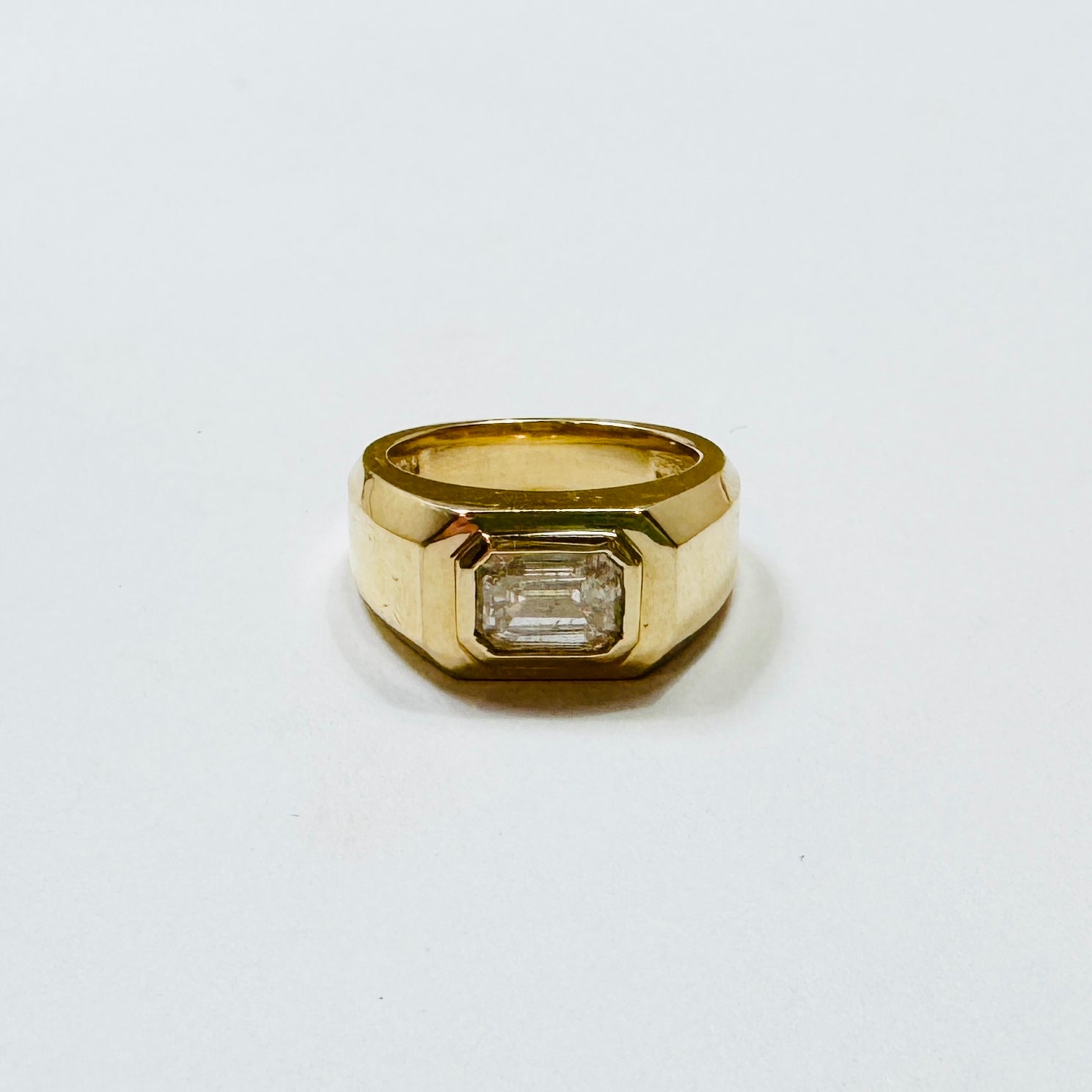 single stone emerald cut diamond pinky ring