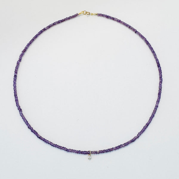 delicate necklace with prong set diamond
