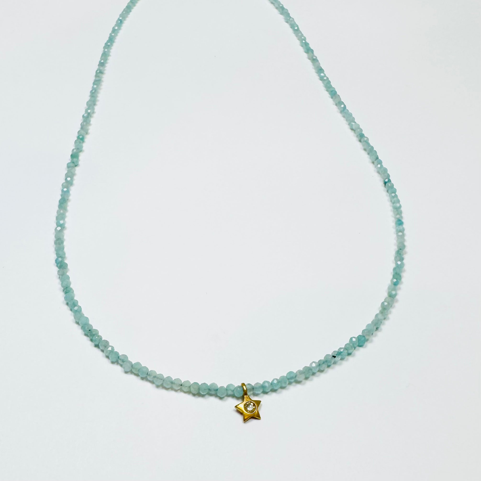 delicate ice blue opal necklace with diamond star charm