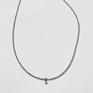 delicate necklace with prong set diamond