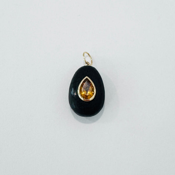 bezel set teardrop citrine on wood