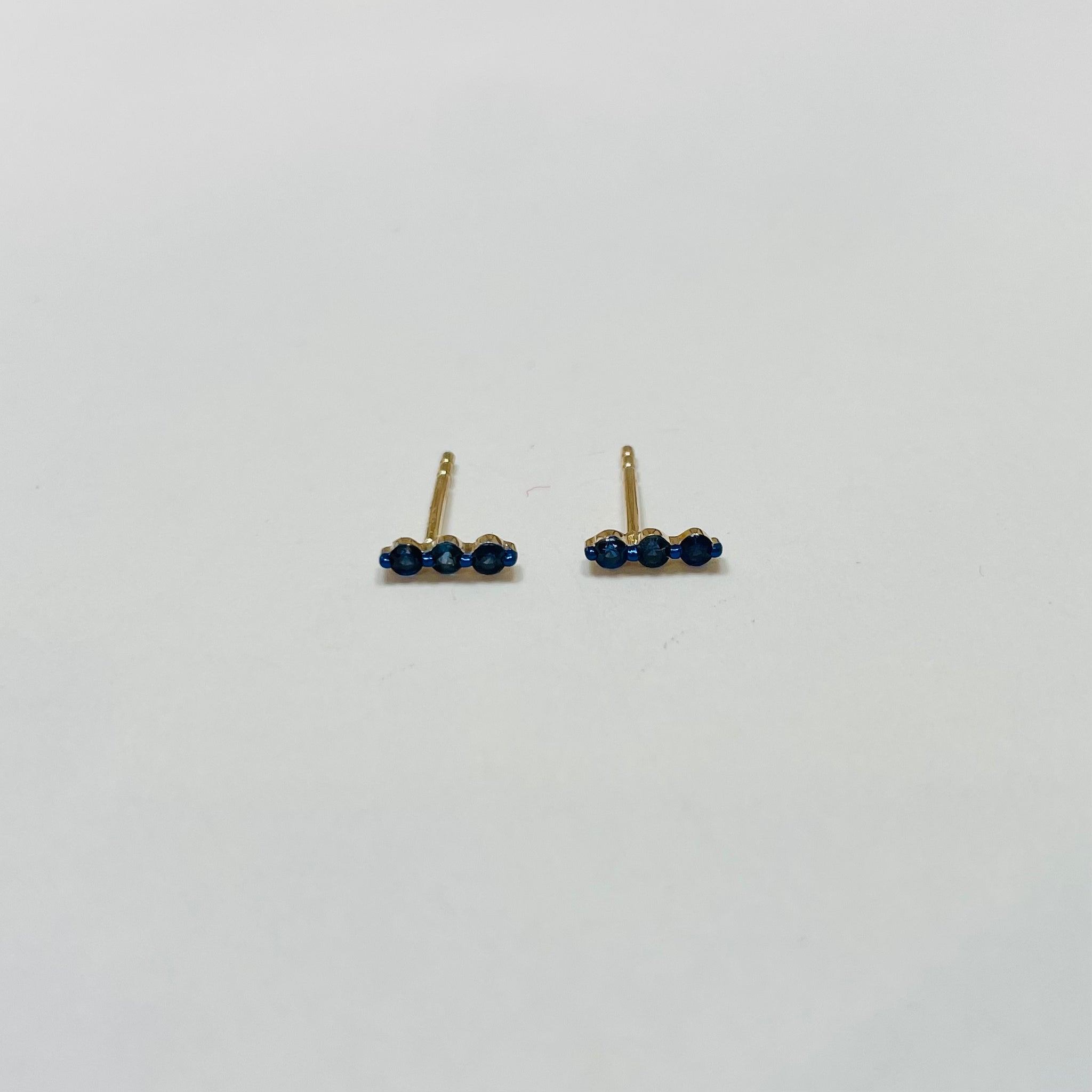 blue sapphire floating bar studs