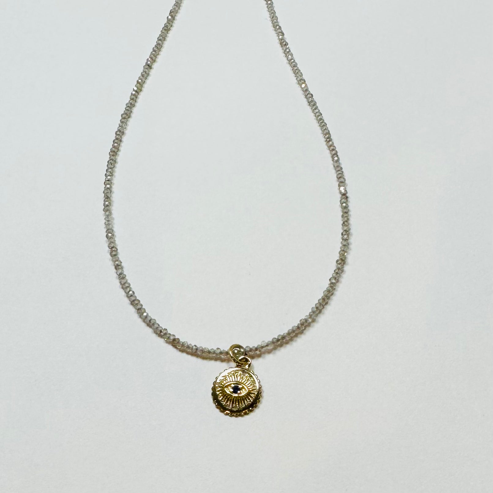 delicate Zircon necklace with evil eye medallion charm