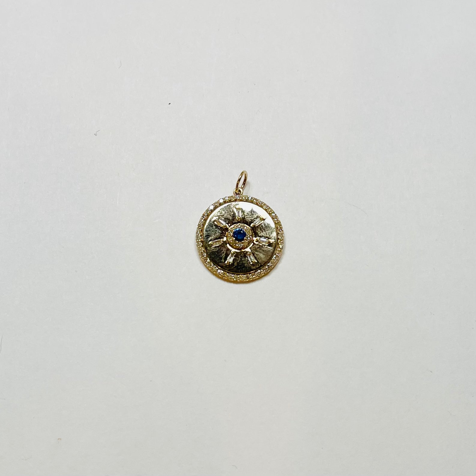 sand-dollar pendant, blue sapphire