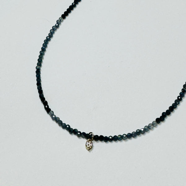 delicate necklace with prong set diamond