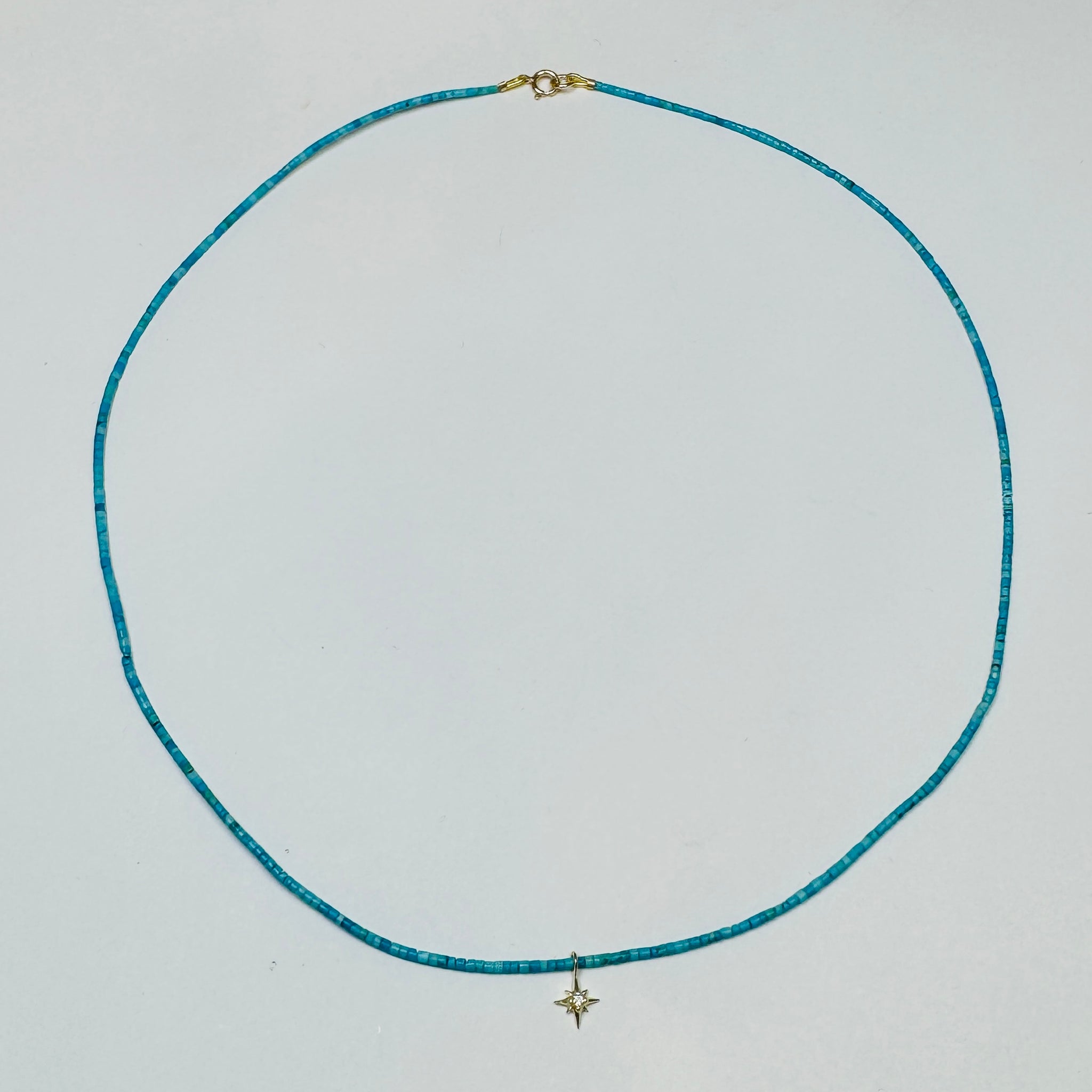 delicate turquoise necklace with diamond star charm