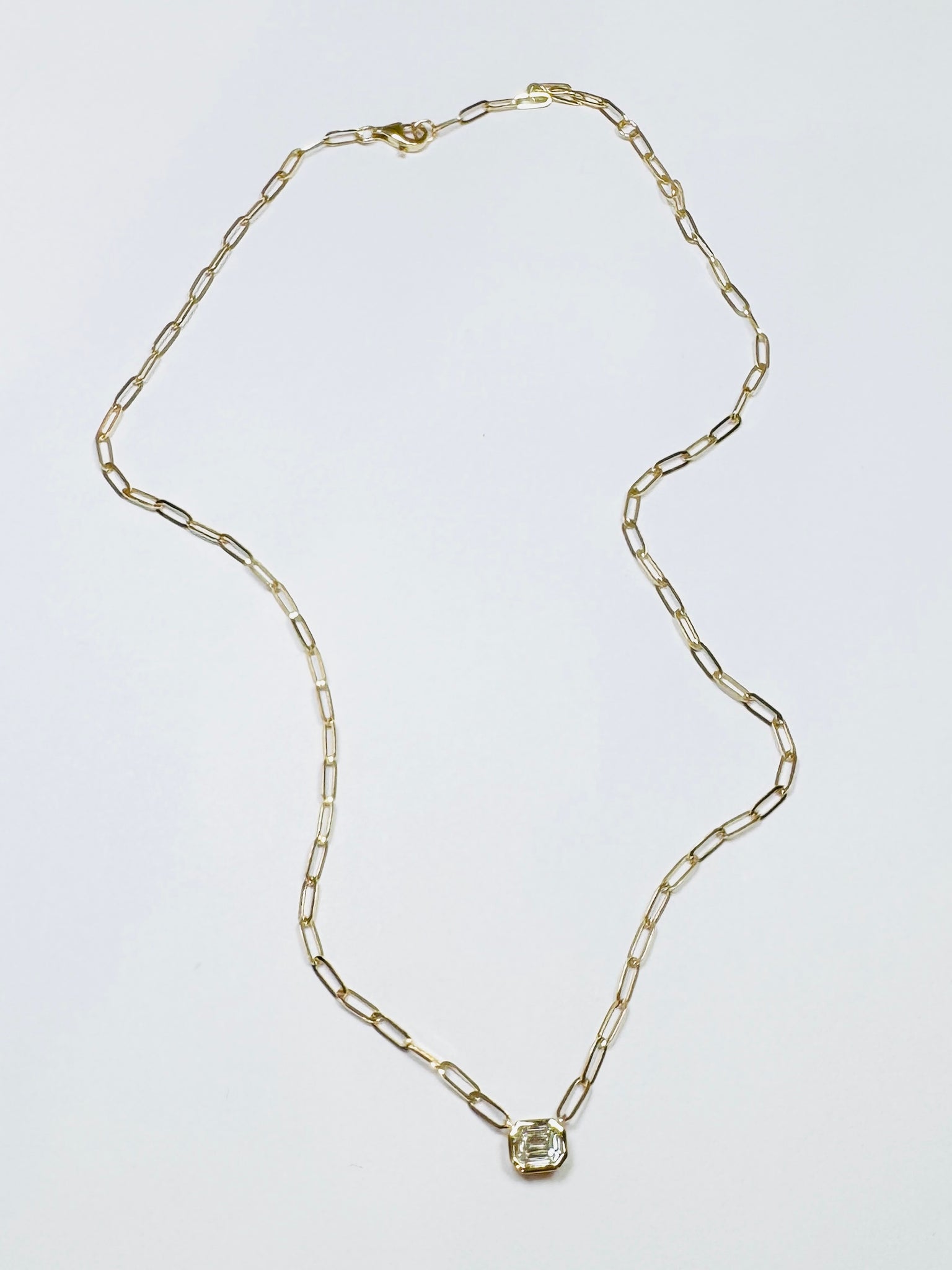 14 kt gold illusion set diamond on paperclip chain, 1.25