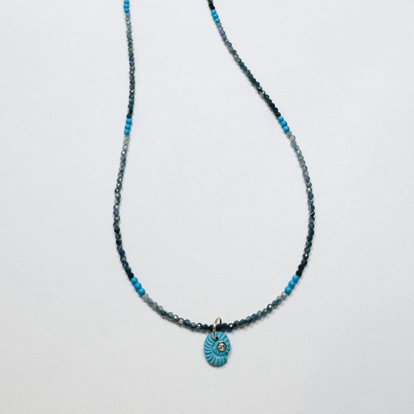 delicate lapis necklace with turquoise nautilus charm