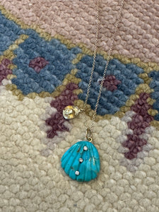 turquoise shell and hat on chain