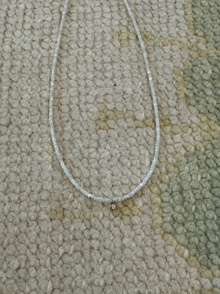 delicate necklace with bezel set diamond