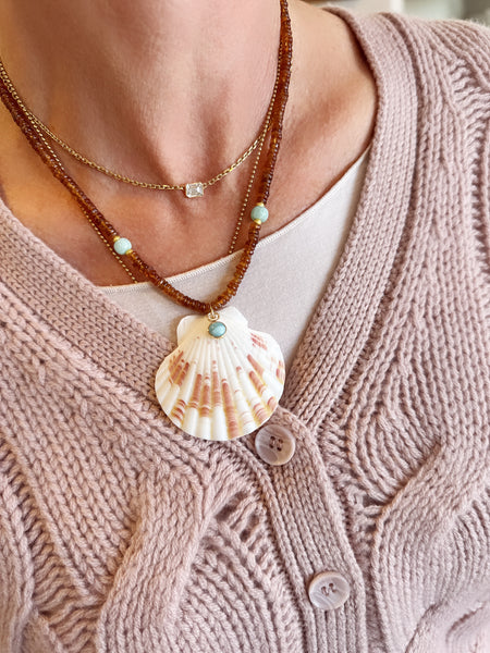 Hessonite garnet necklace with shell pendant