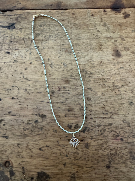 evil eye charm on Kumihimo silk cord