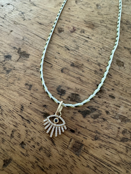 evil eye charm on Kumihimo silk cord