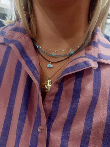 delicate lapis necklace with evil eye charm