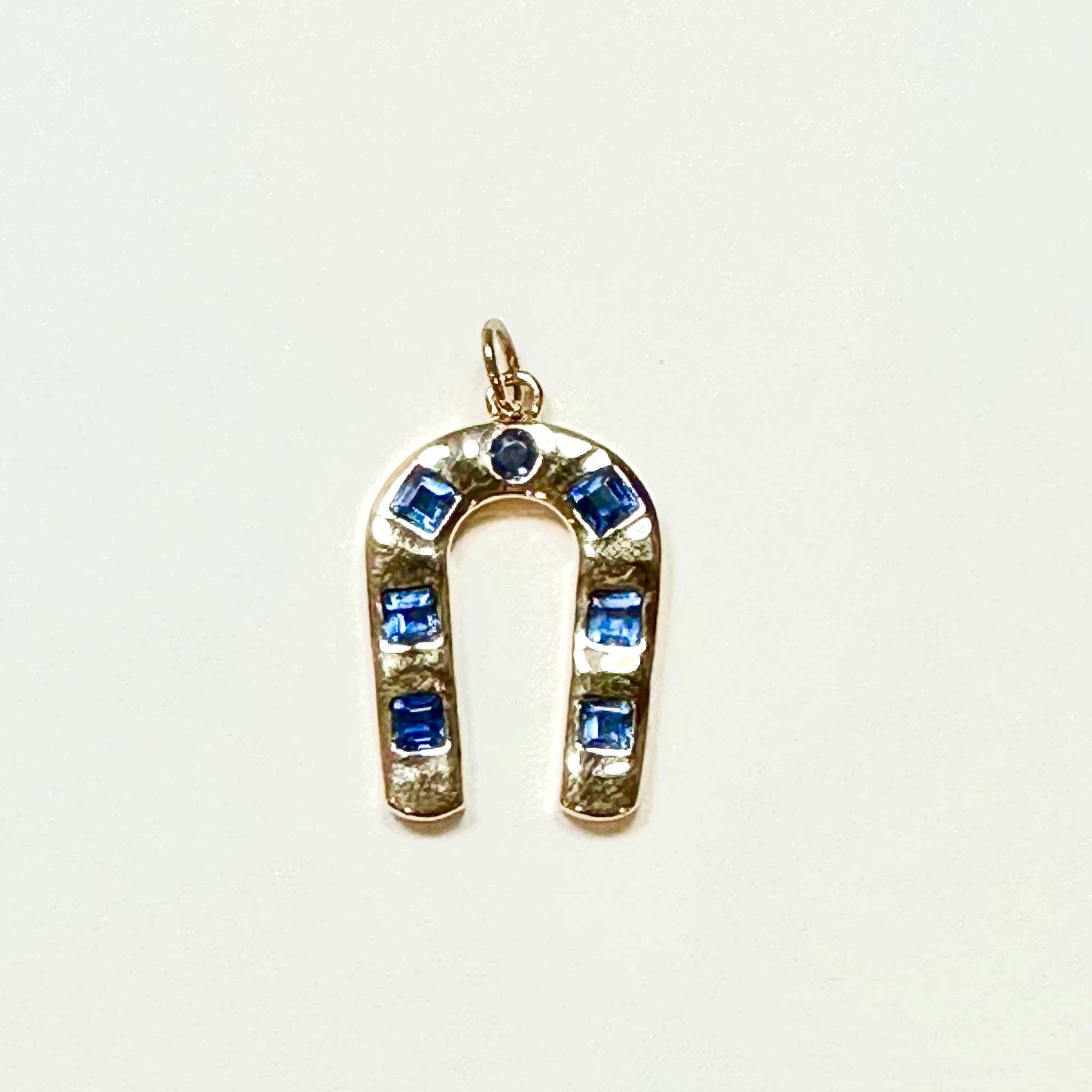 sapphire horseshoe pendant