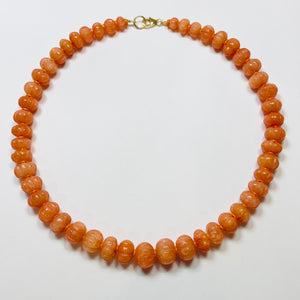 carved tangerine candy necklace