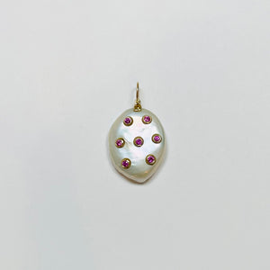 baroque pearl pendant with bezel set pink sapphires