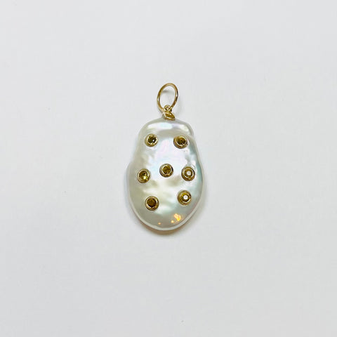 baroque pearl pendant with bezel set yellow sapphires