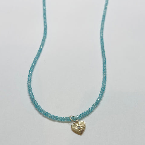 delicate blue topaz necklace with heart charm