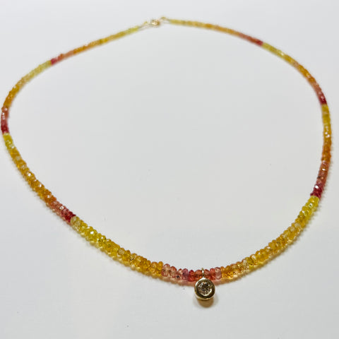faceted sapphire necklace with bezel set diamond
