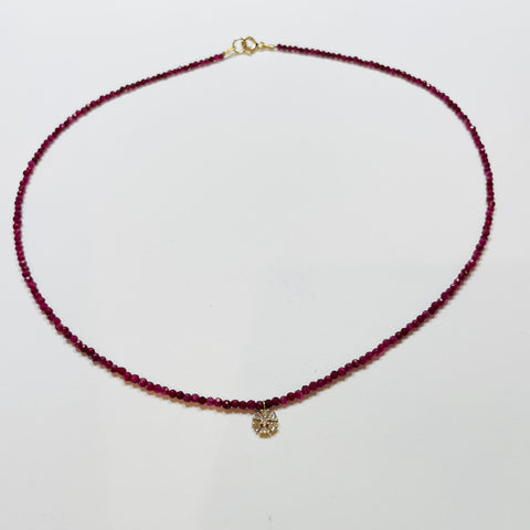 delicate ruby necklace with snowflake charm