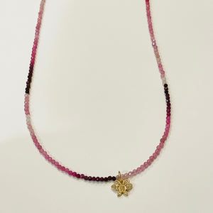 delicate shaded ruby necklace with diamond butterfly charm
