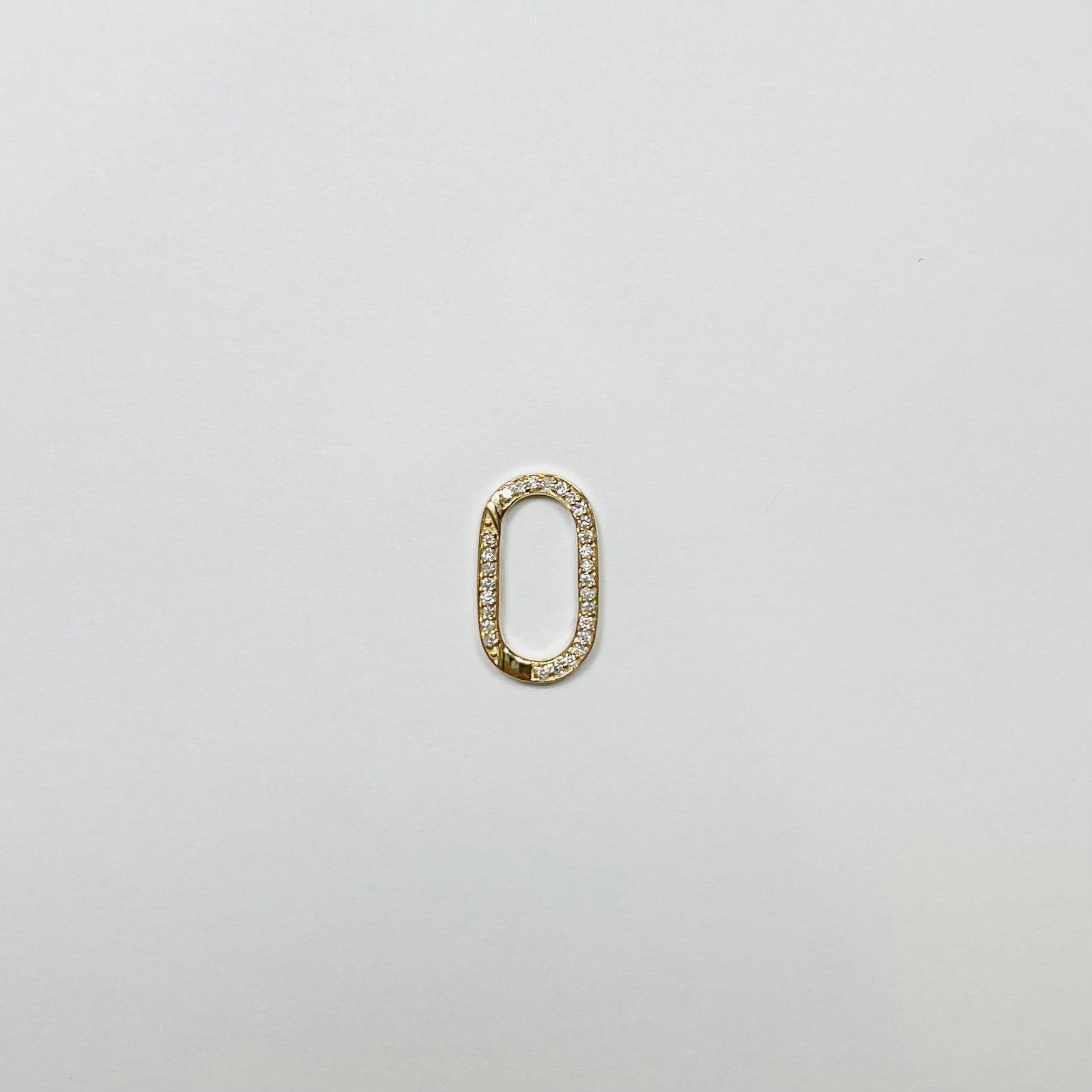 oval diamond and gold connector