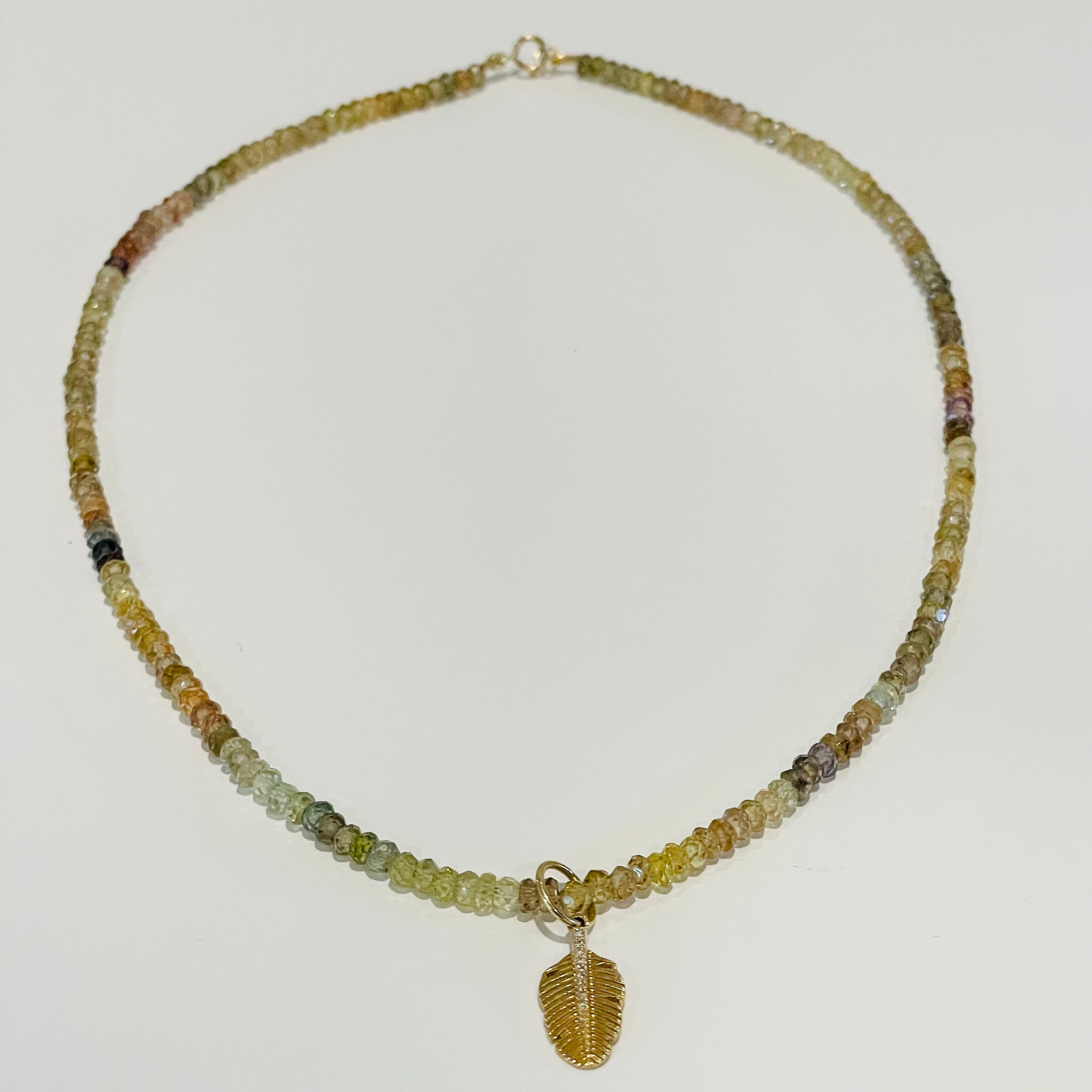 sapphire necklace with leaf charm