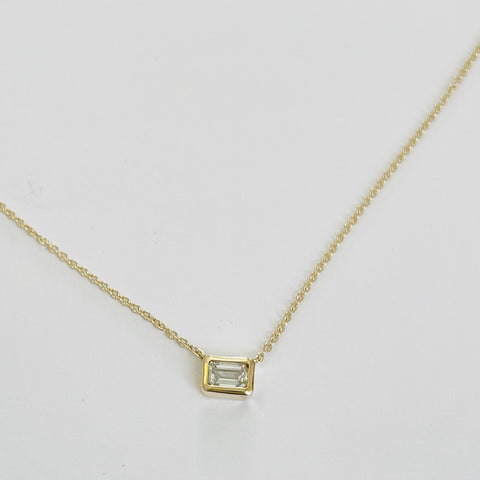 emerald cut diamond on gold chain